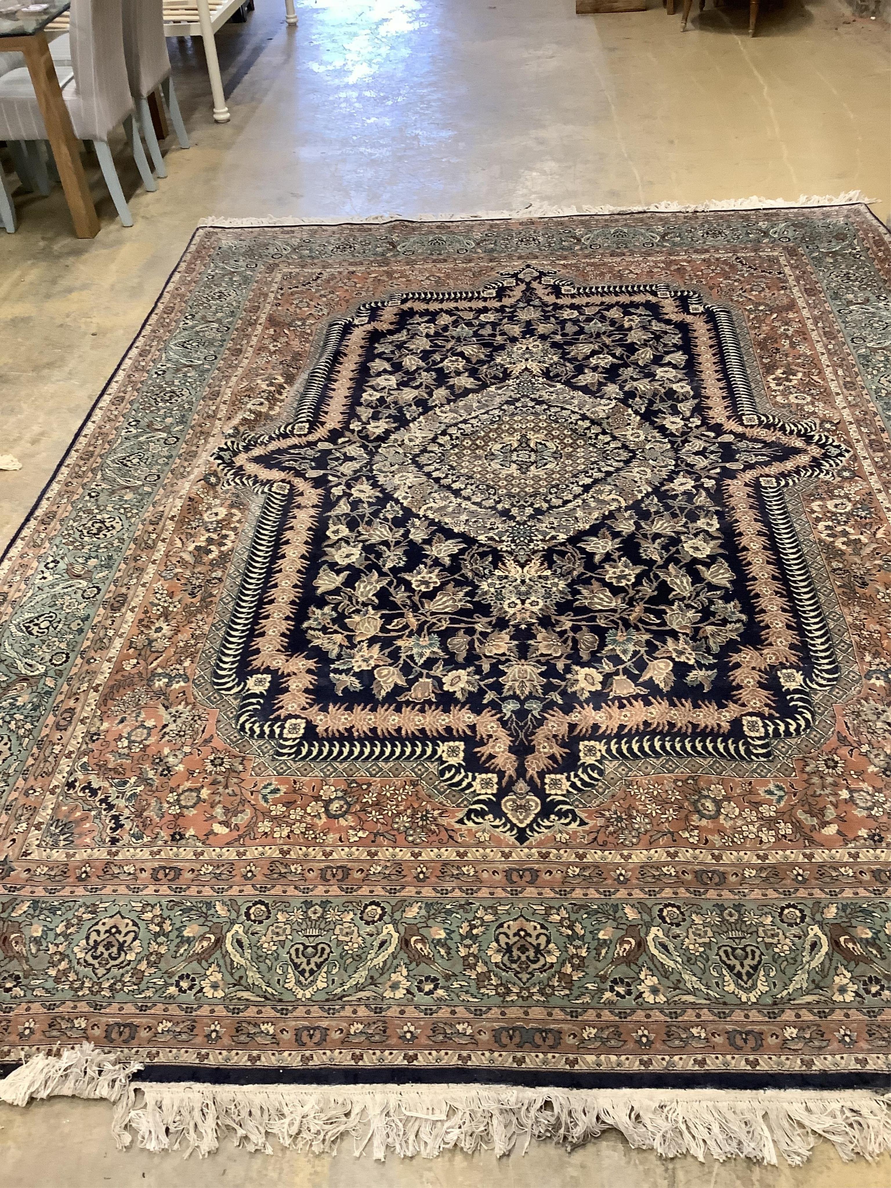 An Isfahan design blue ground rug, 330 x 250cm. Condition - good